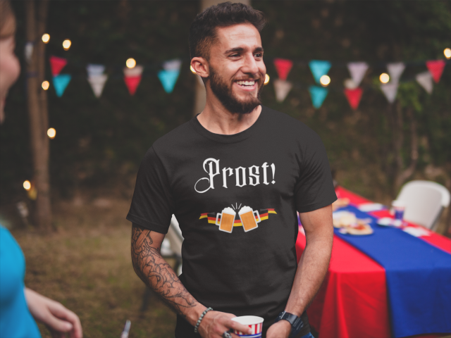 Man wearing shirt with the word 'PROST!' depicted on it.